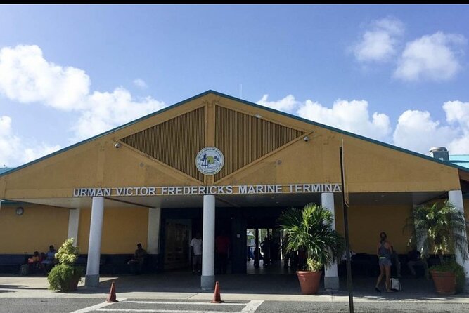 Prince Taxi & Tours St.Thomas Airport transfer to Redhook Ferry - Airport arrival with Amir and a name sign
